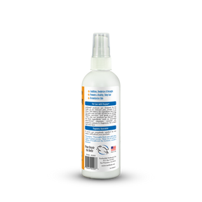White spray bottle with label on a white background