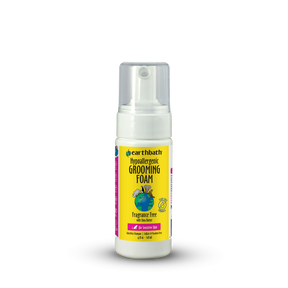 Earthbath grooming foam bottle with yellow label on a white background