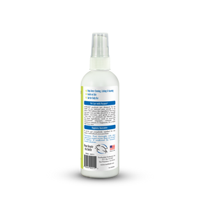 White spray bottle with a label on a white background