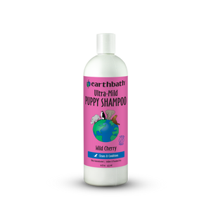 Bottle of Earthbath Ultra-Mild Puppy Shampoo with a pink label on a white background