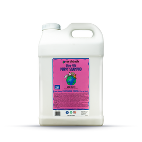 Gallon container of Earthbath Ultra-Mild Puppy Shampoo on a white background