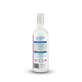 White spray bottle with a label on a white background