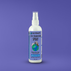 Earthbath 3-in-1 Deodorizing Spray bottle on a purple background