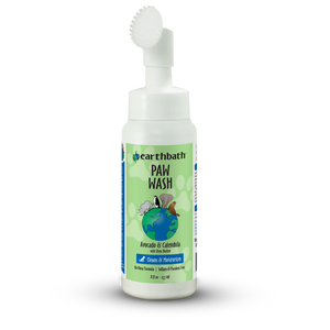 Bottle of Earthbath Paw Wash with a brush on a white background